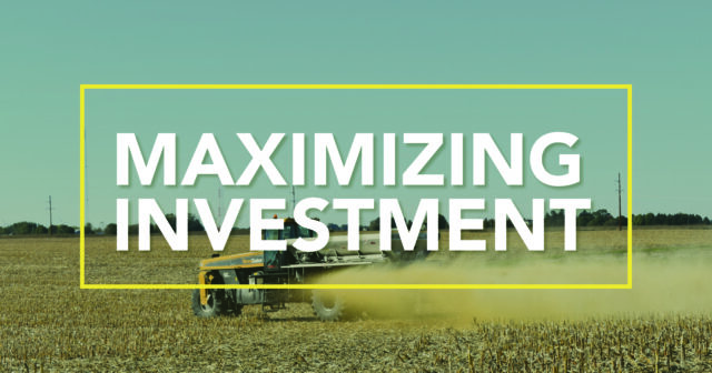 the words maximizing investment over a picture of a tractor spreading seed in a field